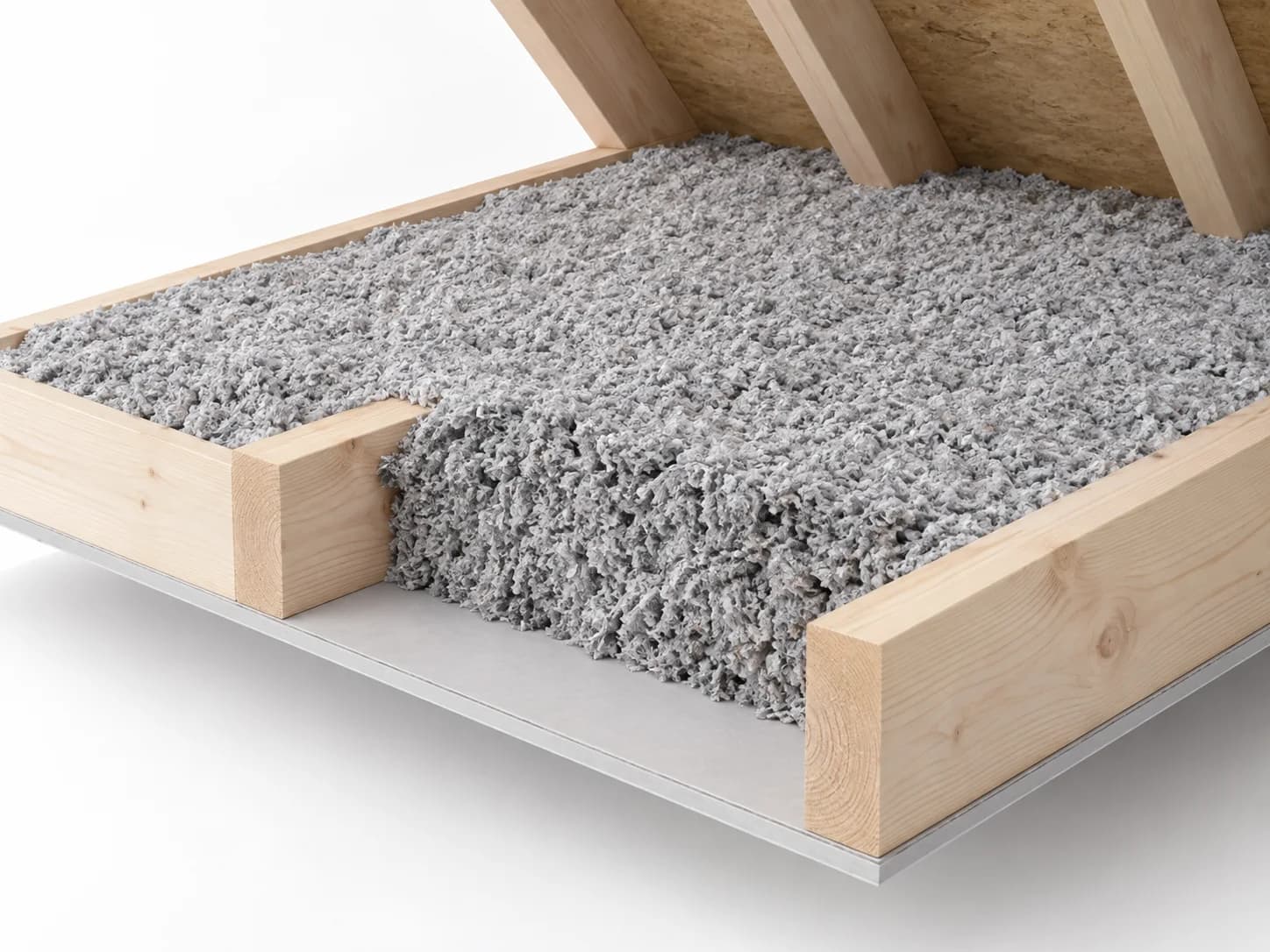 Attic floor cutaway showing loose-fill insulation over and between timber ceiling joists.