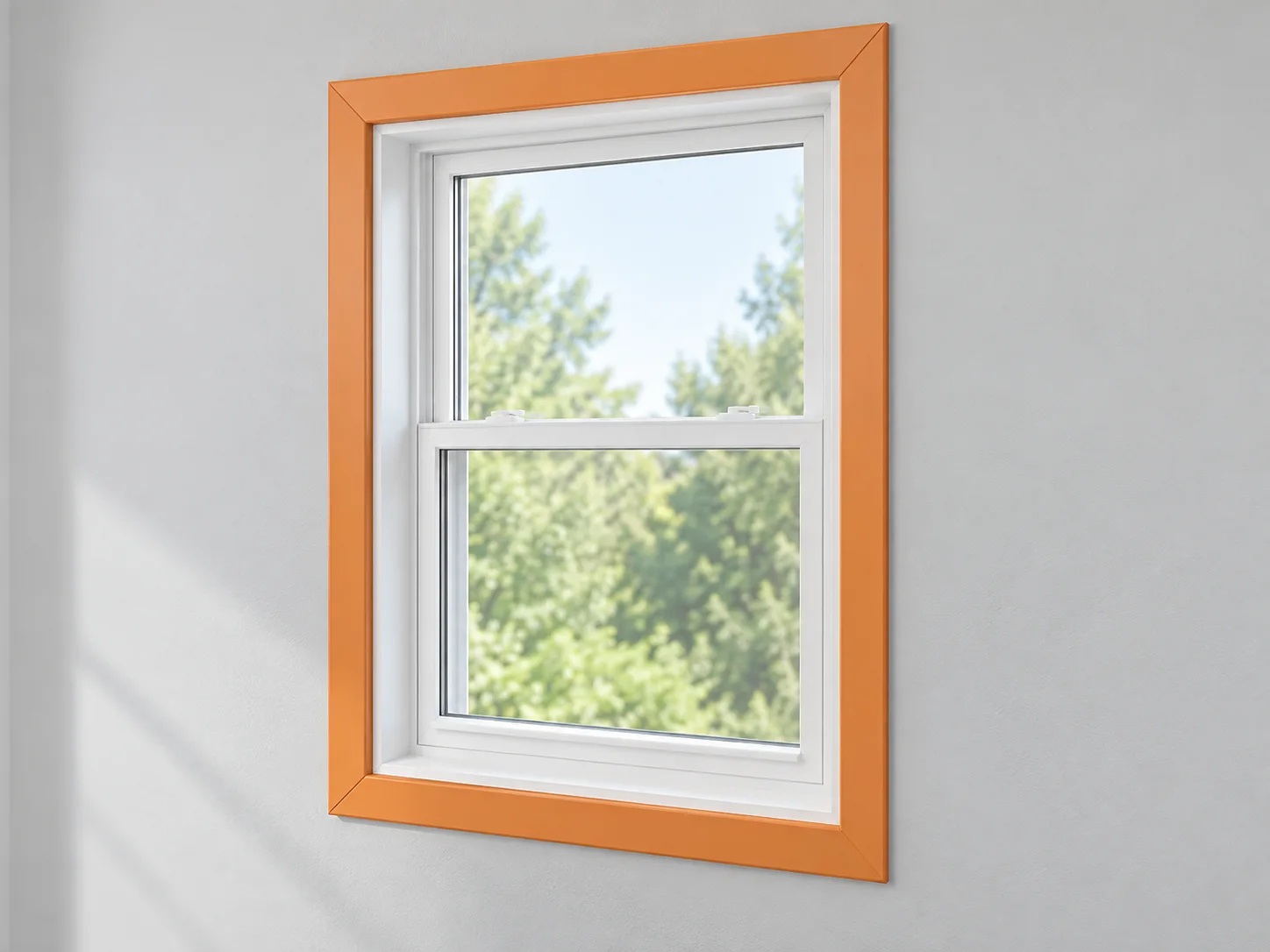 Window in a wall with its surface trim casing highlighted orange around the white frame.