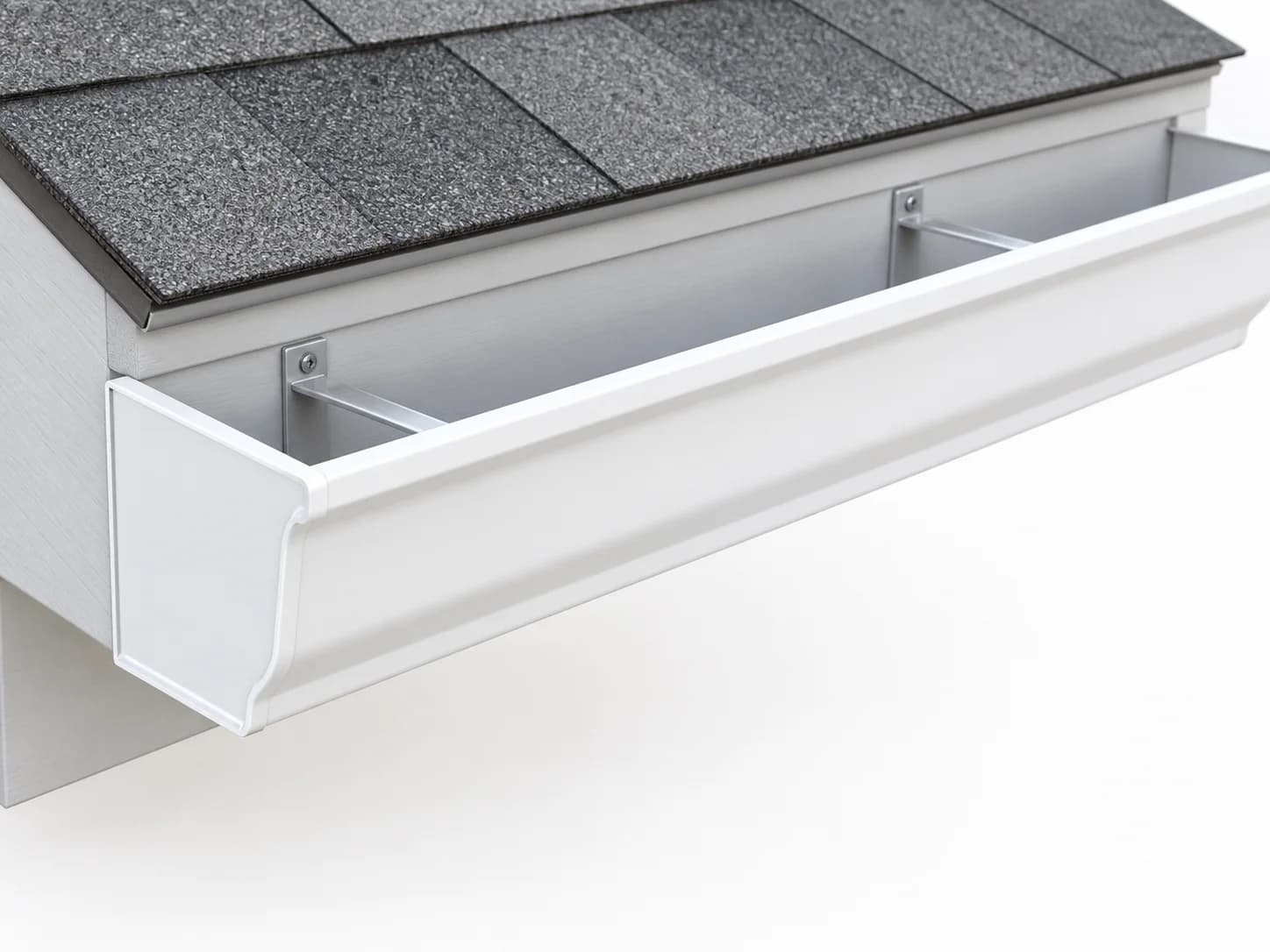 Short gutter section along a roof edge, showing its open collection channel and capped end.