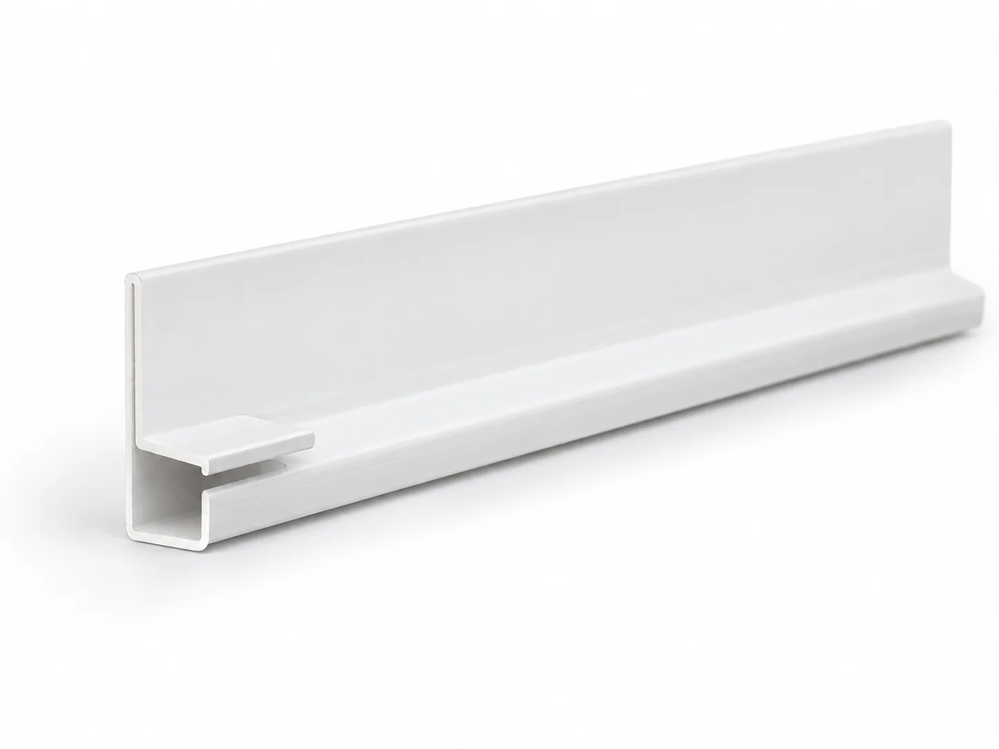 White soffit F-channel extrusion showing its nailing flange and narrow receiving pocket at the cut end.