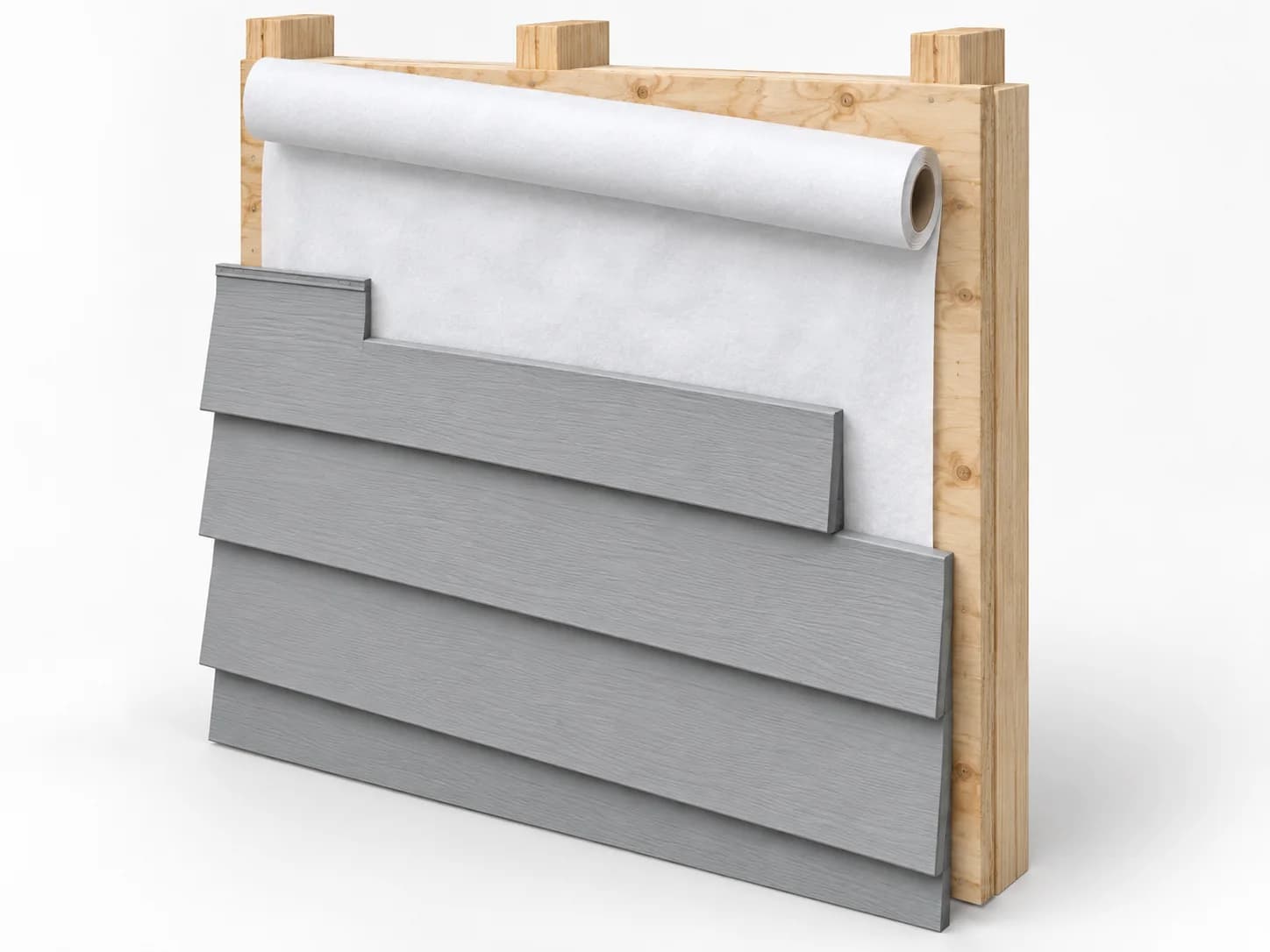 White housewrap membrane partly covering wood sheathing behind offset siding courses.