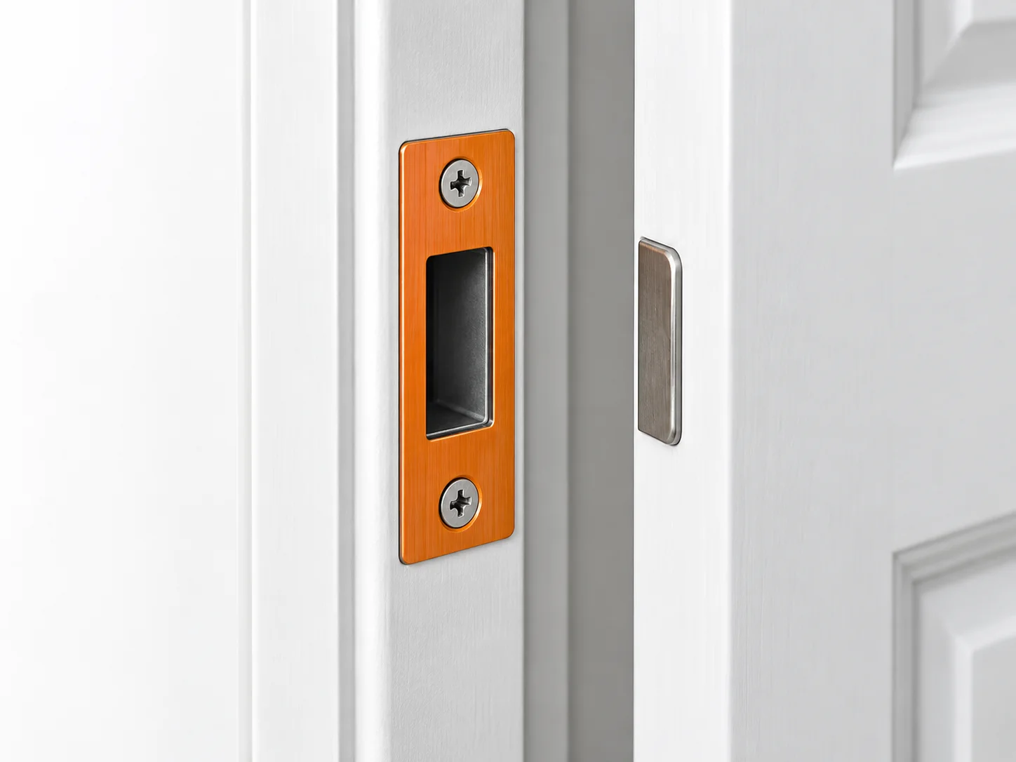 Door jamb with the strike plate highlighted orange around the recessed latch opening.
