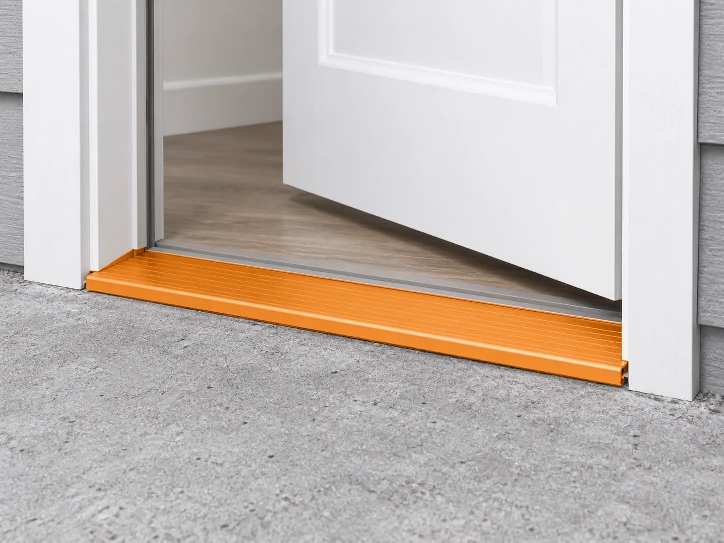 Lower doorway detail with the fixed threshold highlighted orange beneath the partly open door.