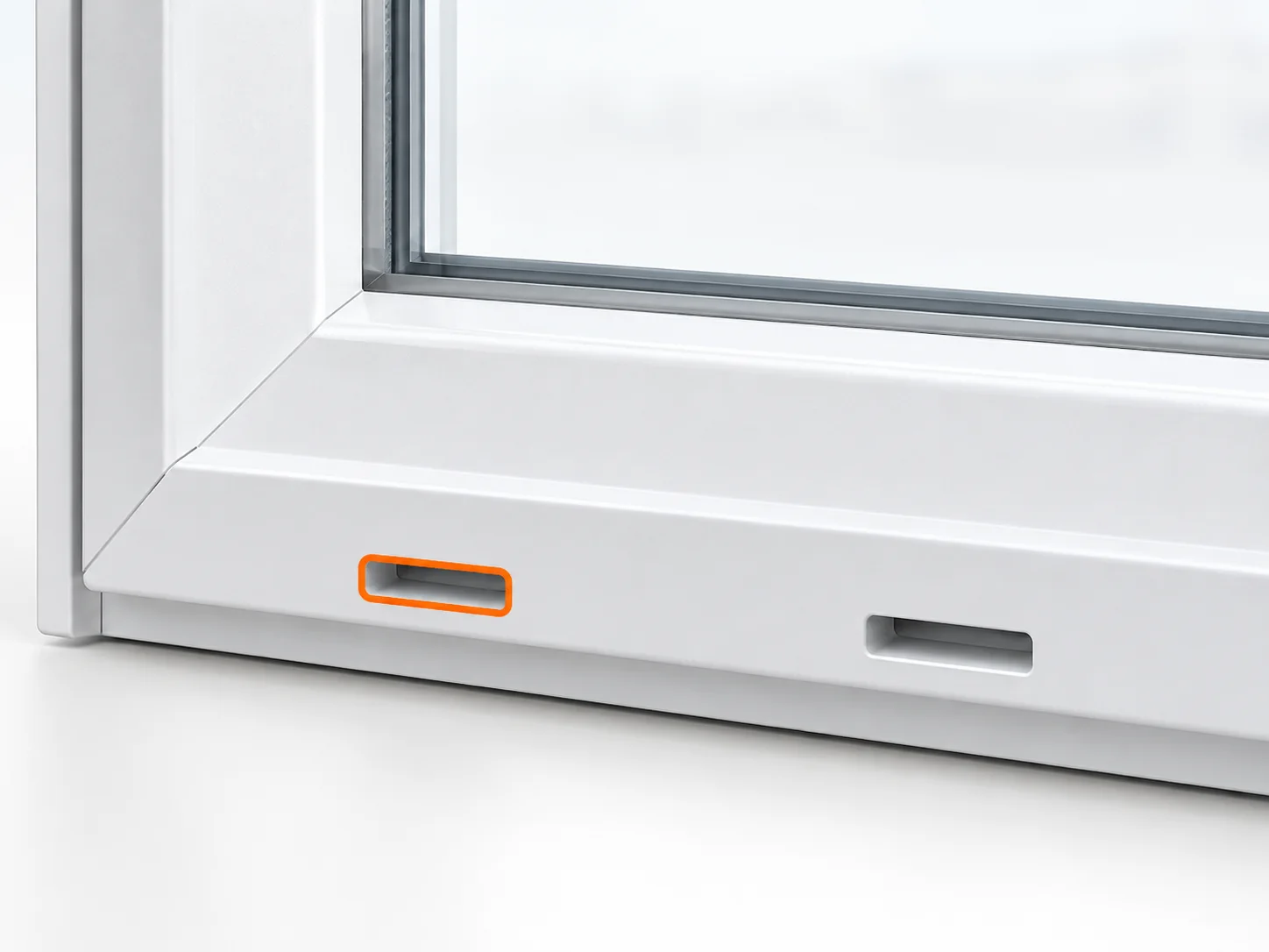 Lower exterior window frame with a small drainage opening identified by an orange edge highlight.