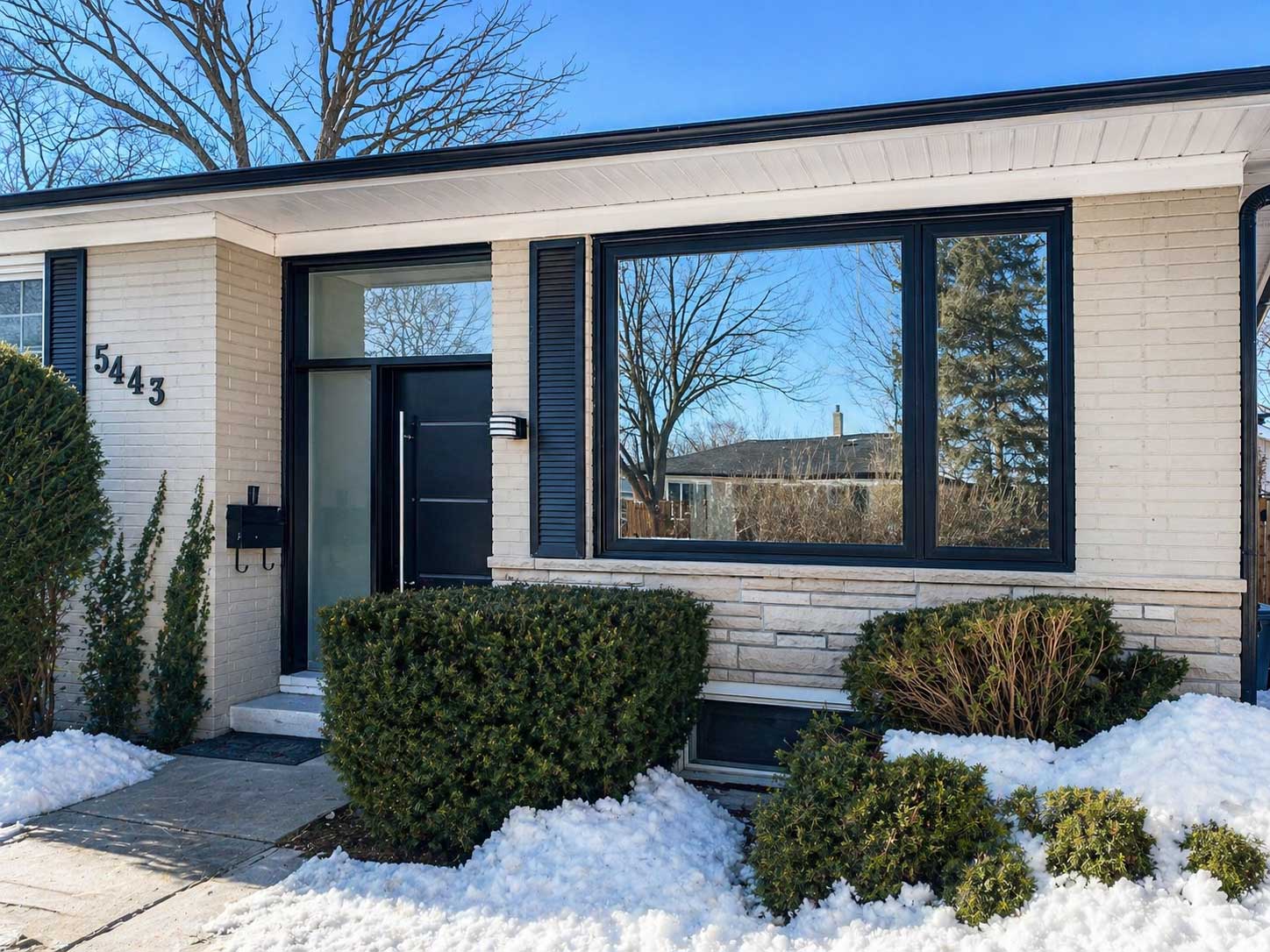 Completed windows on a bungalow with snow outside.